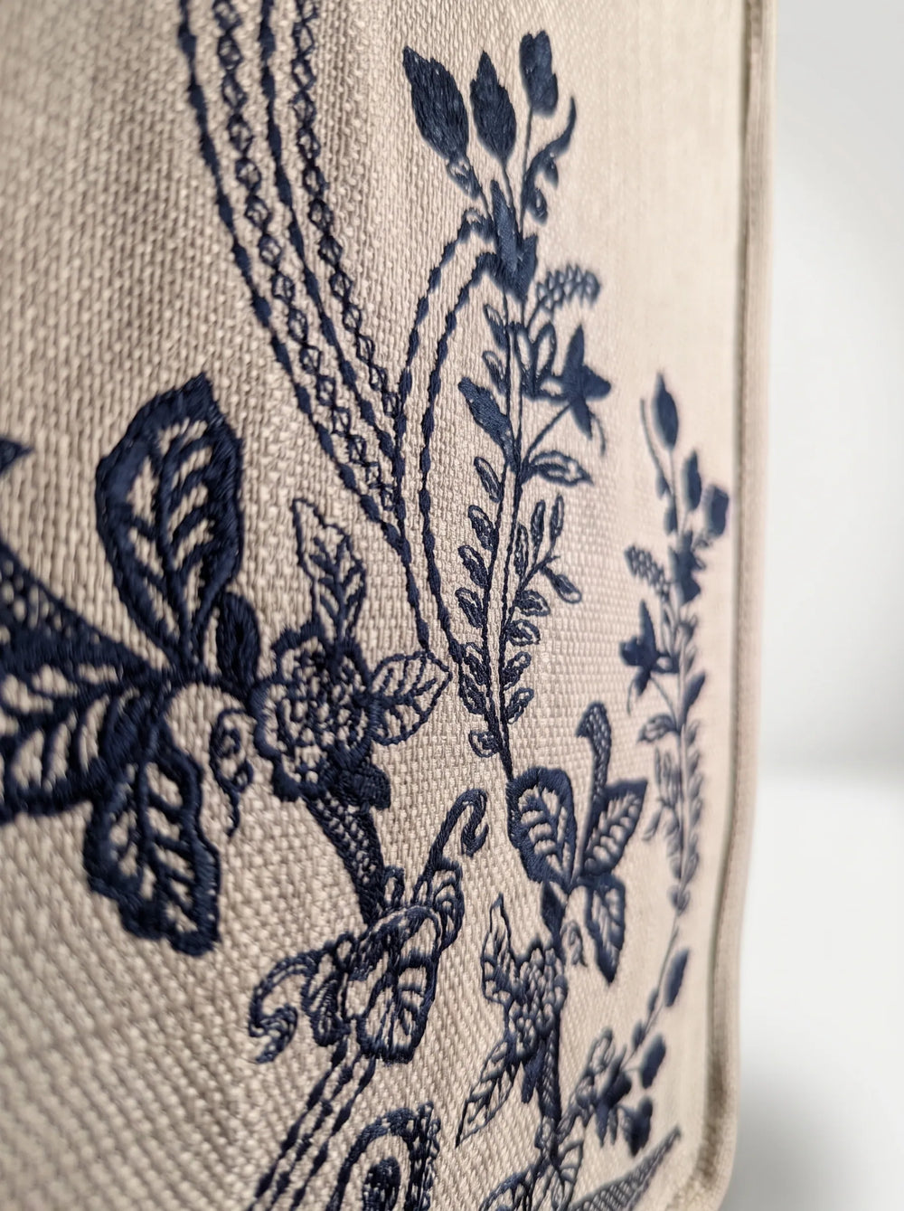 Close-up of black botanical floral embroidery on natural jute tote bag artisan canvas bag for women WestStyle Pakistan