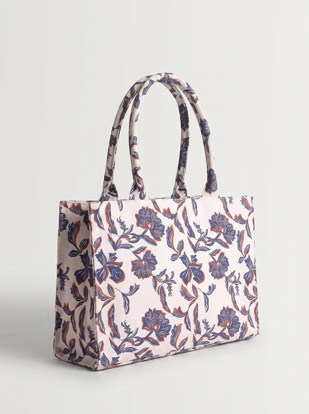 Printed canvas handles on WestStyle blue floral tote bag showing continuous botanical pattern canvas tote bag for university Pakistan