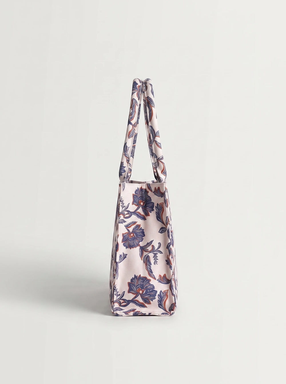 Close-up of navy blue and terracotta block-print floral pattern on WestStyle canvas tote bag printed fabric bag for women Pakistan