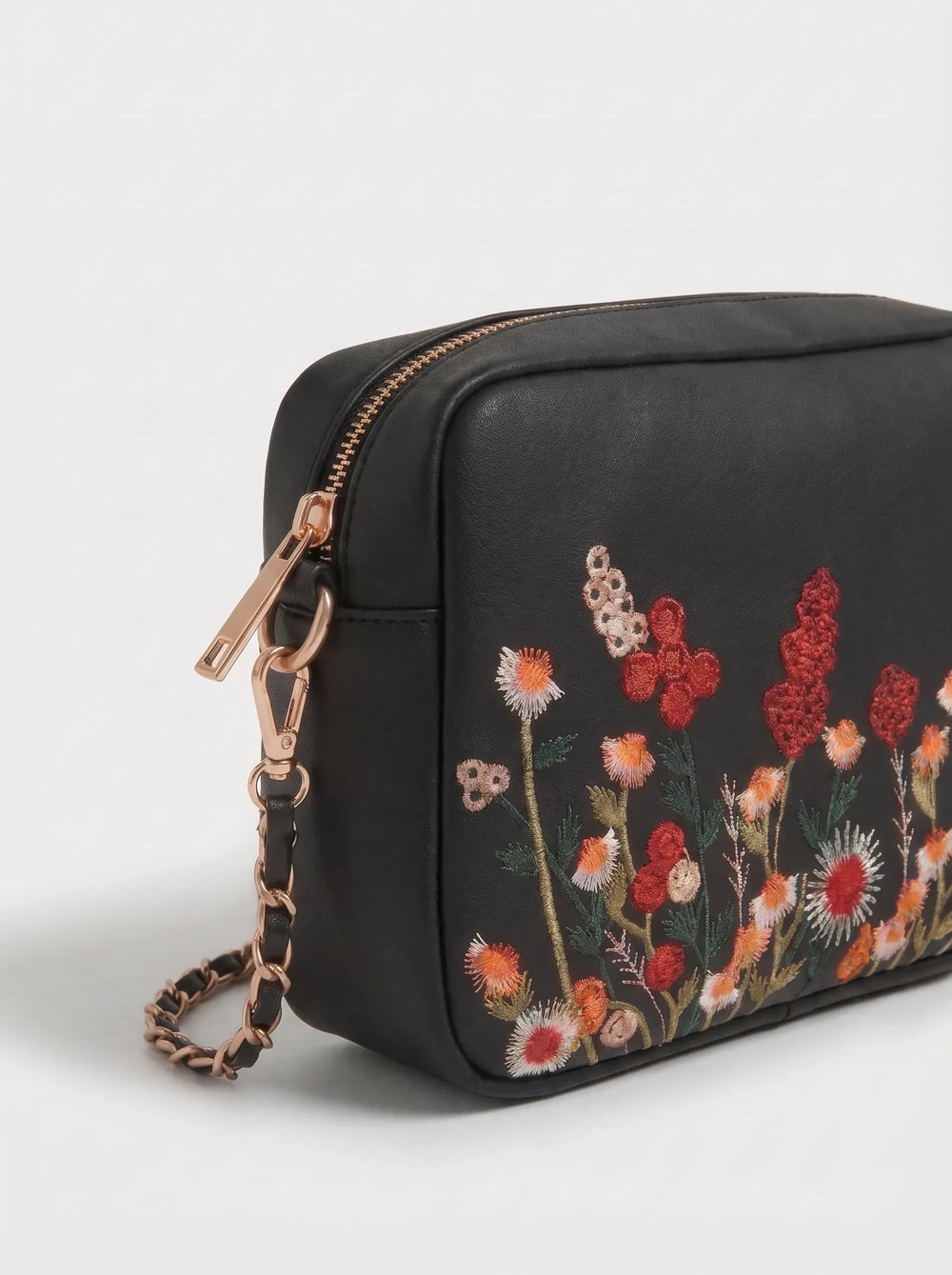 Close-up of raised multicolour wildflower embroidery on WestStyle Chic Crossbody black bag designer crossbody handbag Pakistan