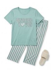 Teal pajama set with 'Dear Bed I Love You' text and striped pants, accompanied by a slippers on a white background.