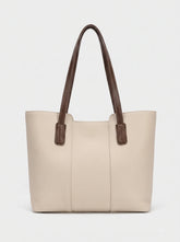 WestStyle cream leather tote bag three-quarter view showing trapezoid silhouette and brown handle tabs ladies tote bag Pakistan