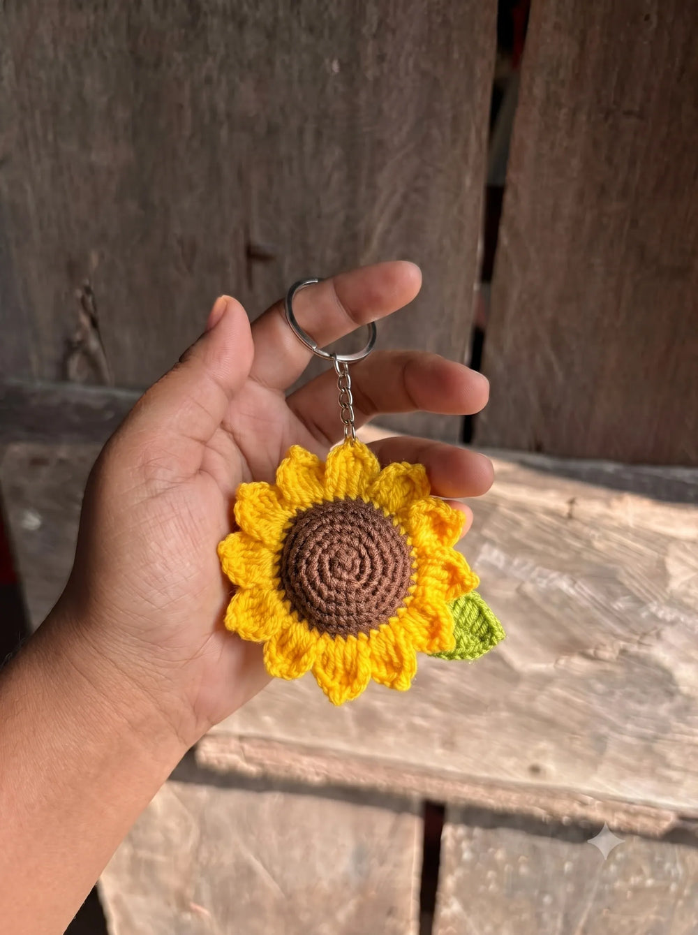 Close-up of handmade crochet sunflower keychain showing spiral brown center and yellow petals -WestStyle floral bag charm