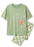 Green pajama set with cartoon design on a white background