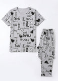 Gray pajama set with 'love' and heart patterns on a white background