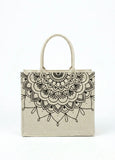 Women beige canvas tote bag against plain white background
