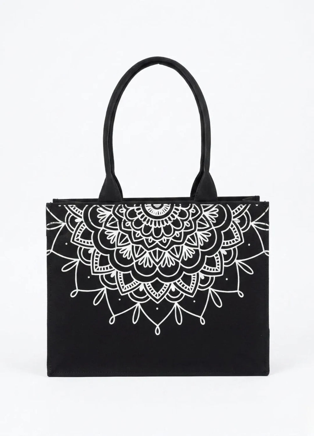 Black tote bag with white mandala design on a white background