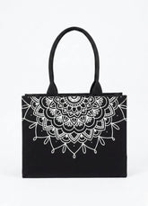 Black tote bag with white mandala design on a white background