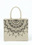 Beige women tote bag with black mandala design on a white background