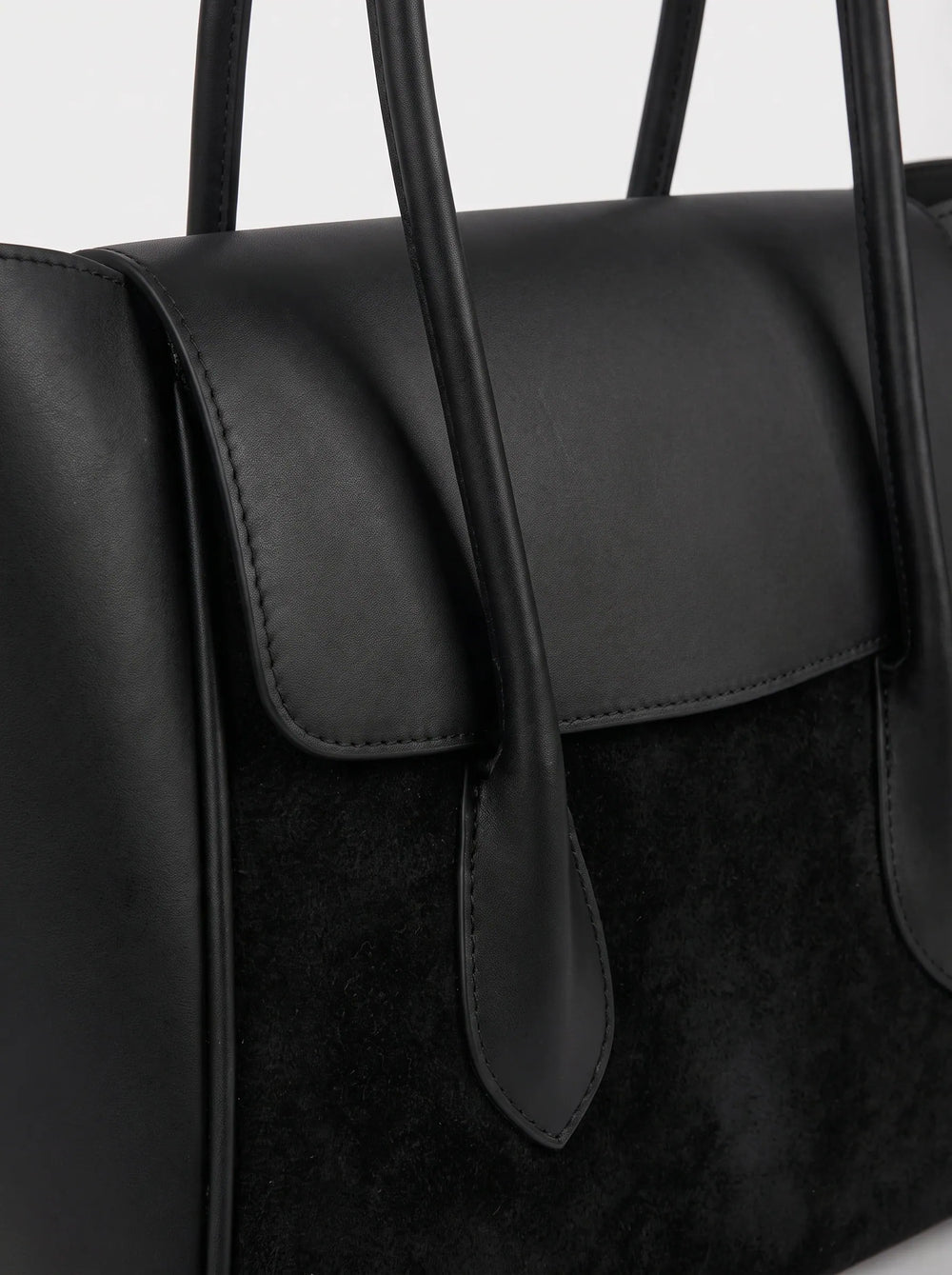 Close-up of tonal black smooth leather and suede panel on WestStyle Pyraflip tote girls tote handbag Pakistan