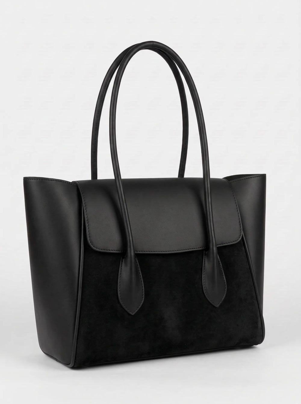 WestStyle Pyraflip black structured tote handbag showing wing silhouette and smooth-suede texture contrast women handbags Pakistan