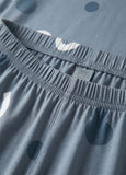 Close-up of blue shorts with a brand label on the waistband.