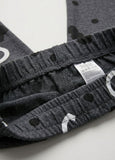 Close-up of gray Pajama with a weststyle label on a white background