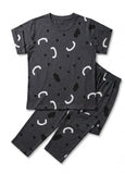 Black pajama set with white abstract patterns on a white background