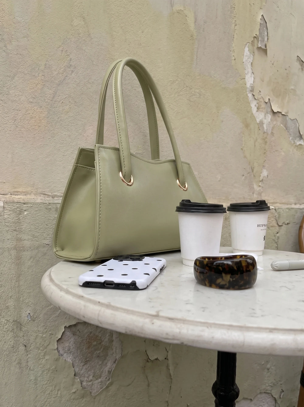 WestStyle Baul Ring sage green mini crossbody bag three-quarter view showing rose gold rings and trapezoidal body trendy bags for girls Pakistan