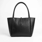 WestStyle Joblet black tote bag front view showing centred turnlock closure and winged silhouette — large ladies handbag Pakistan