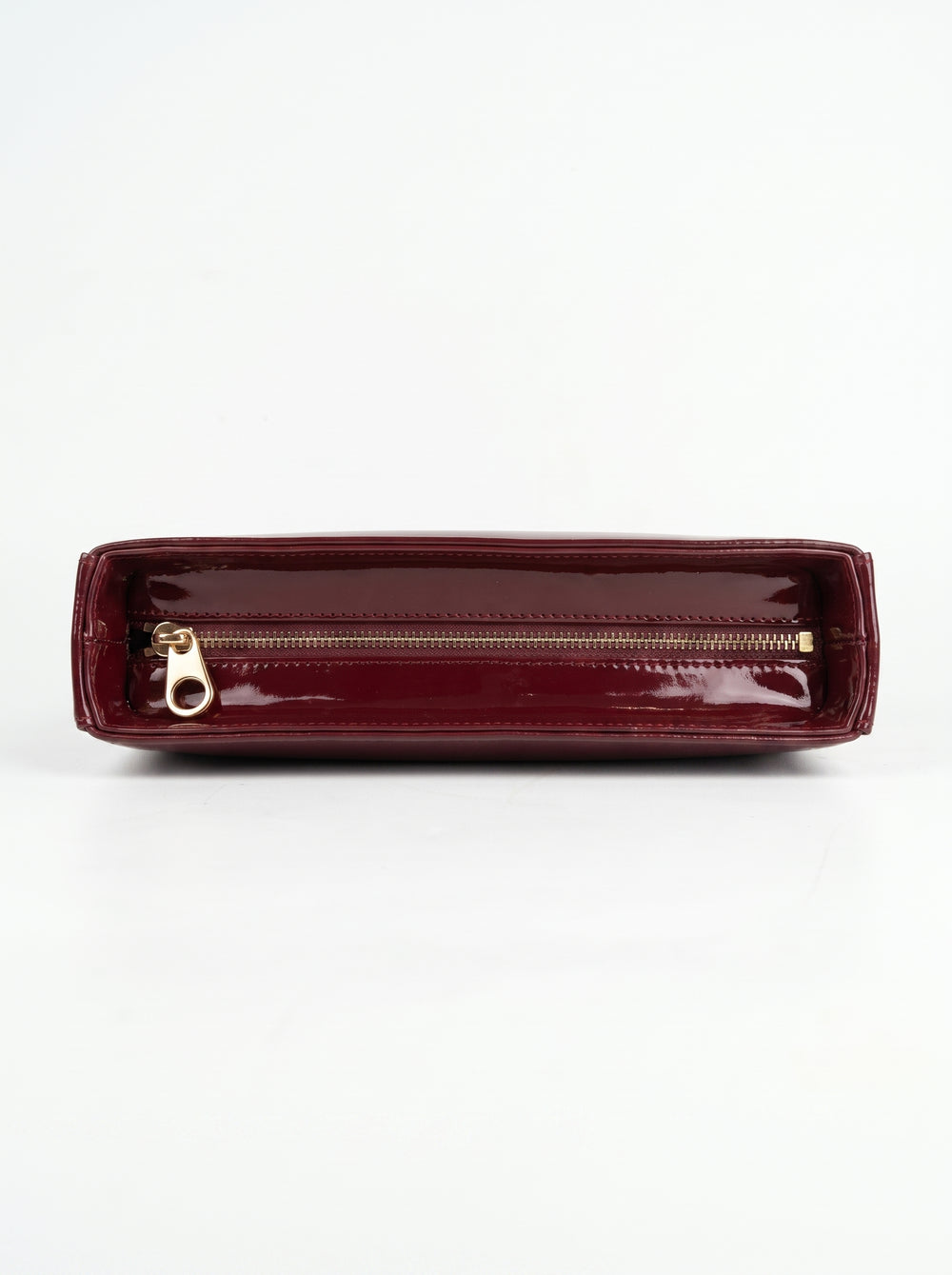 Close-up of deep cherry red patent leather surface and top stitch line on WestStyle Shine Cherry handbag shiny ladies bag Pakistan