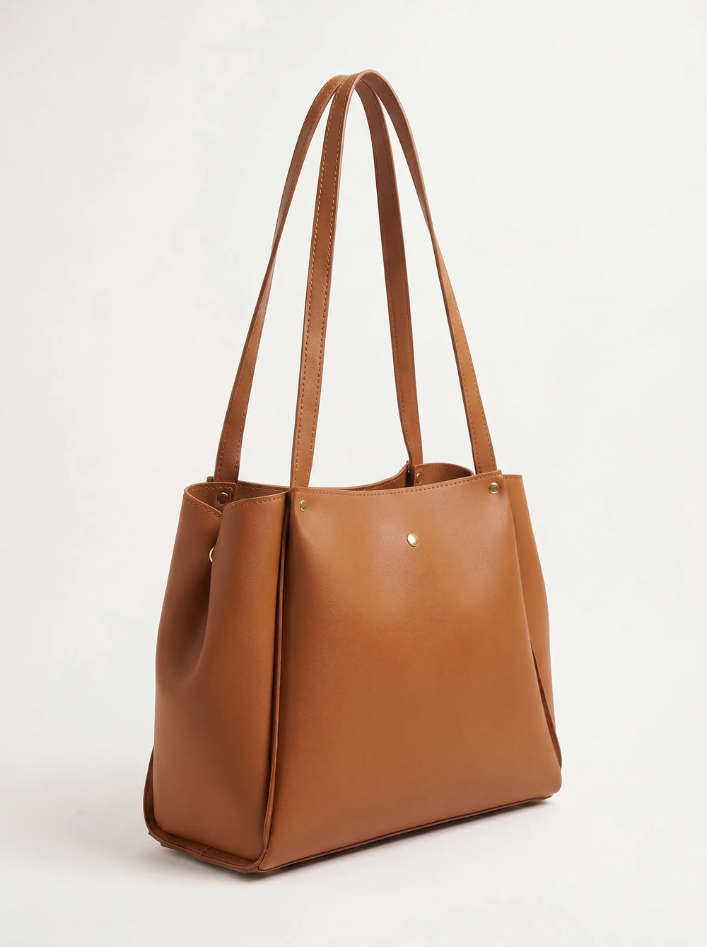 WestStyle tan smooth leather shoulder tote bag worn on shoulder large office and university bag for women in Pakistan