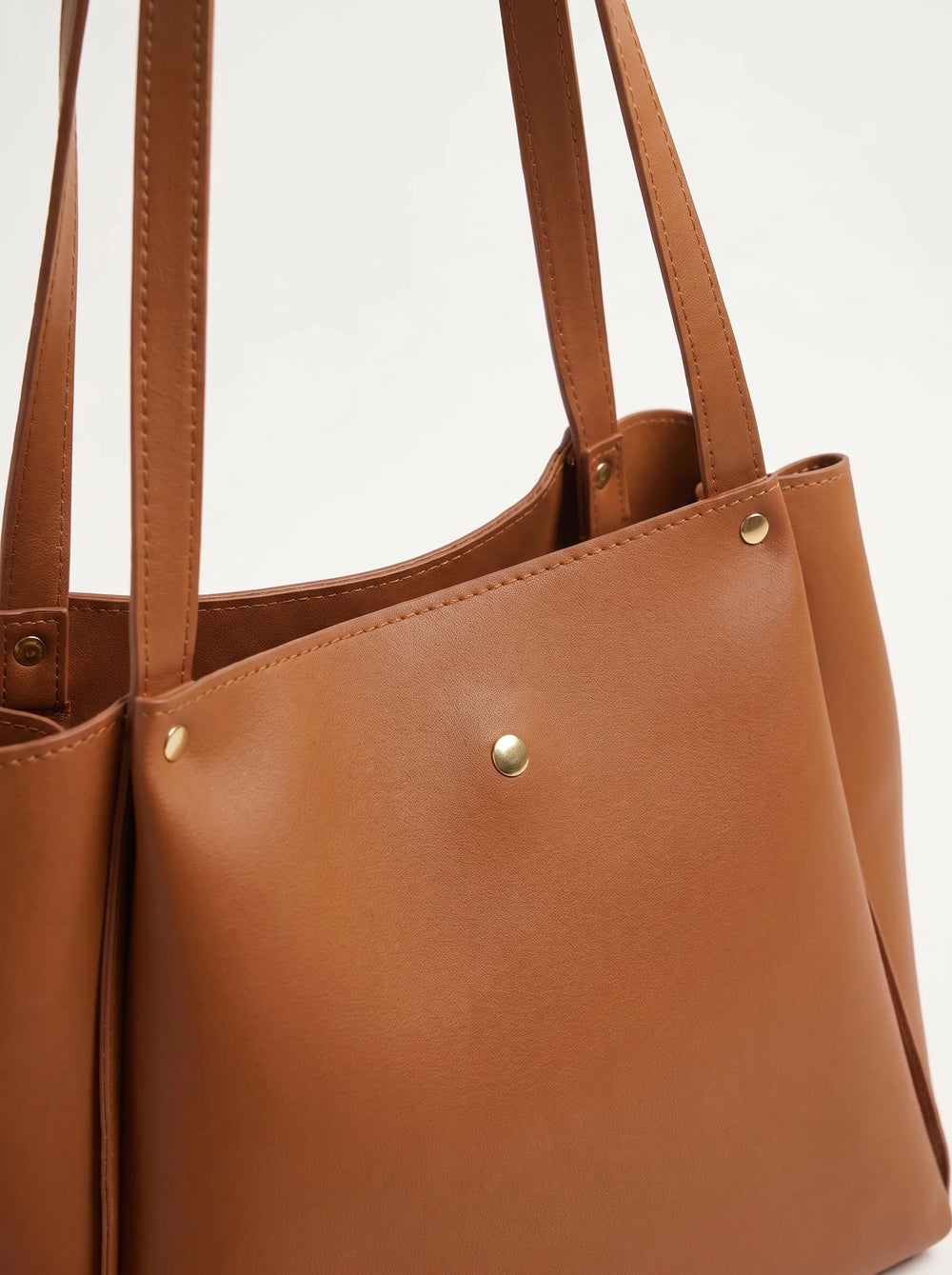 WestStyle tan leather shoulder tote bag three-quarter view showing angled side gussets and open top large ladies tote bag Pakistan