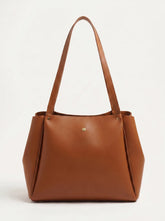 Large tan smooth PU leather shoulder tote bag with gold rivet detail and long flat handles minimal women's tote bag online Pakistan by WestStyle