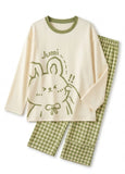 Women pajama set with long-sleeve top and houndstooth pants on a white background