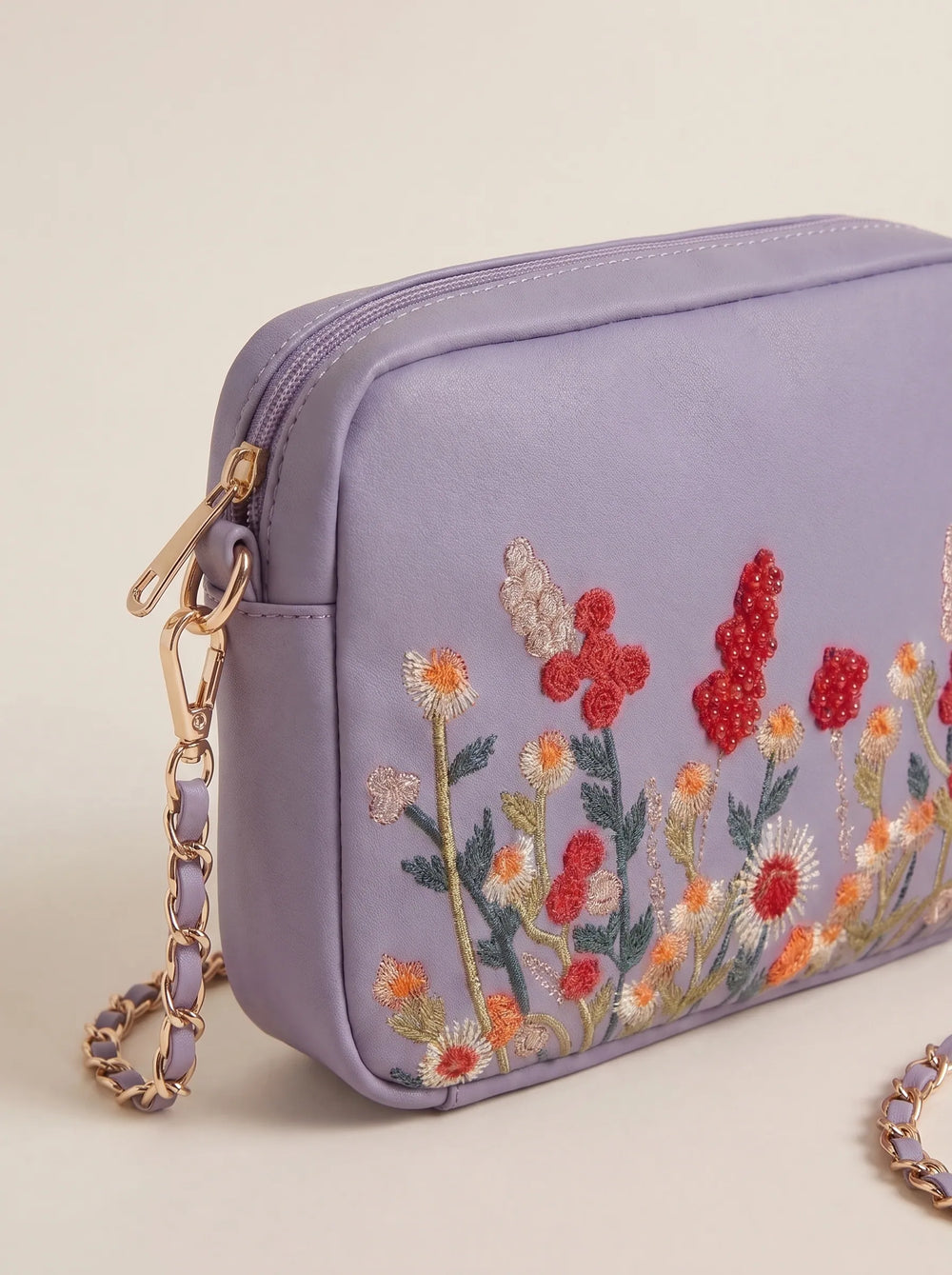 Close-up of raised multicolor wildflower embroidery on WestStyle Chic Crossbody lilac bag designer crossbody handbags for women Pakistan