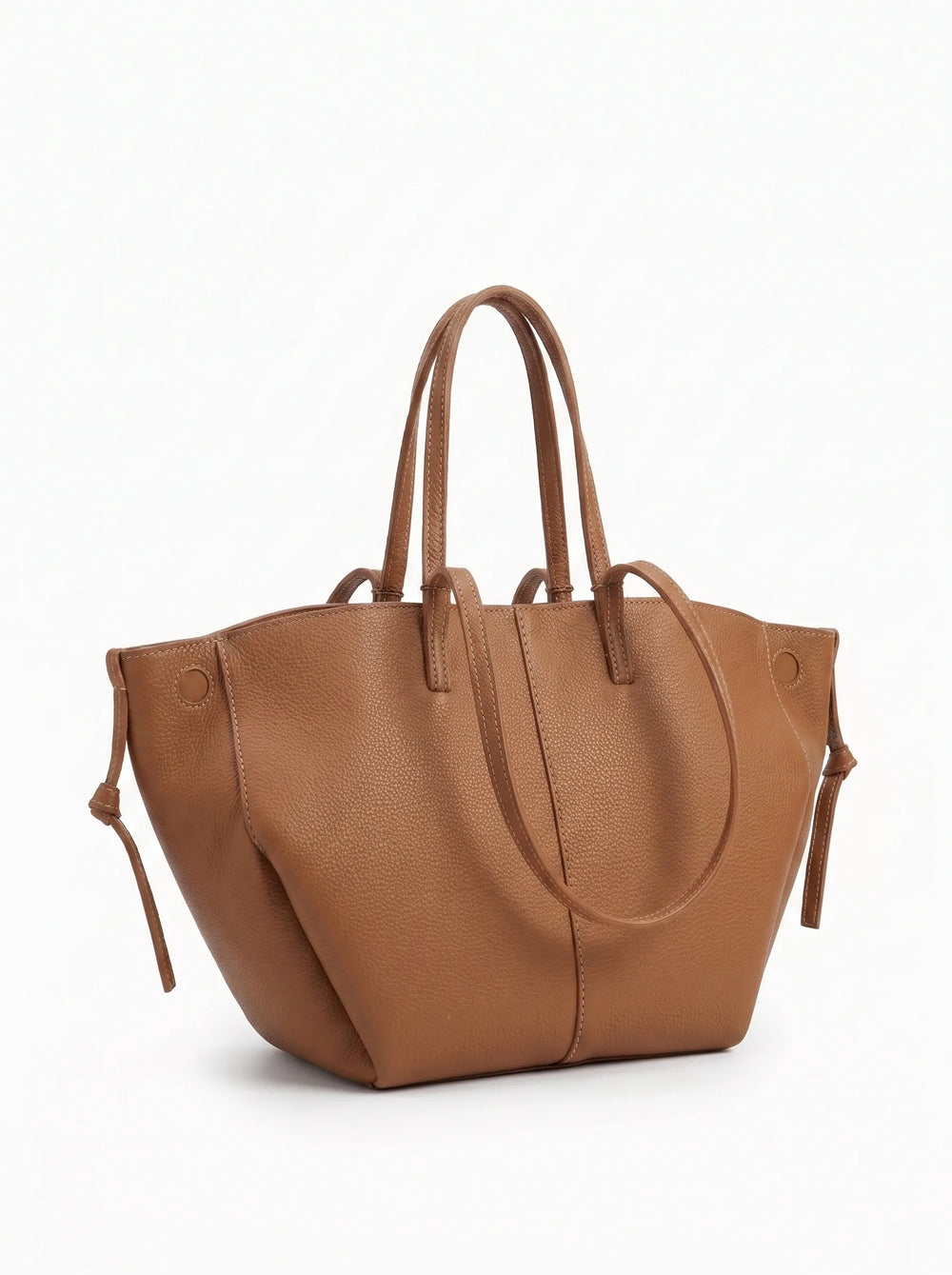 WestStyle Daytona tan pebbled leather tote bag three-quarter view showing sculpted base and dual handles — branded handbag Pakistan