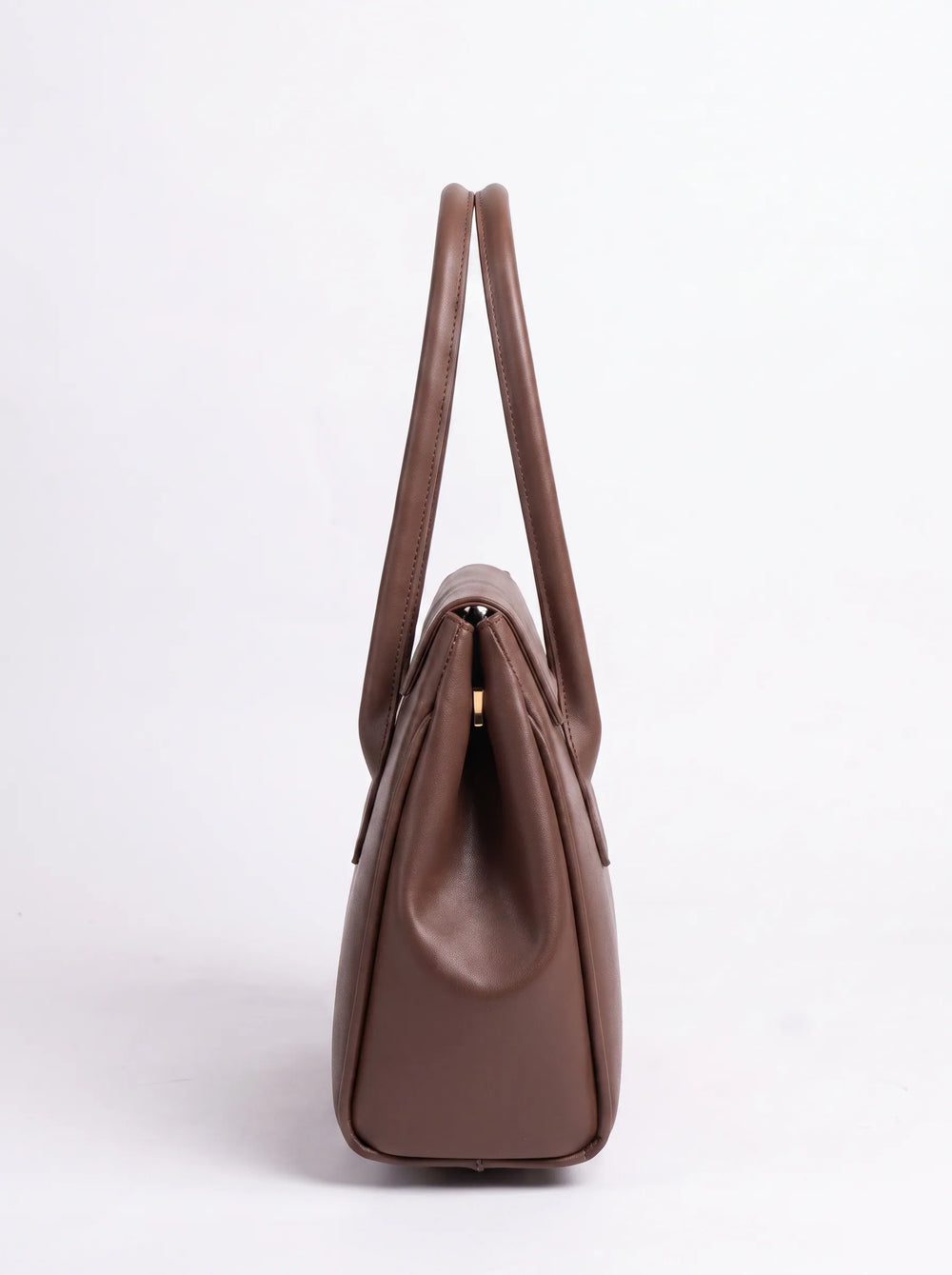 A brown leather handbag shown from the side profile against a clean white background.