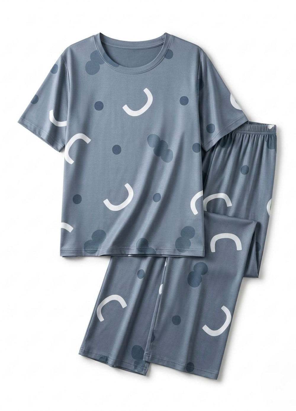 Blue pajama set with white crescent moon patterns on a white background