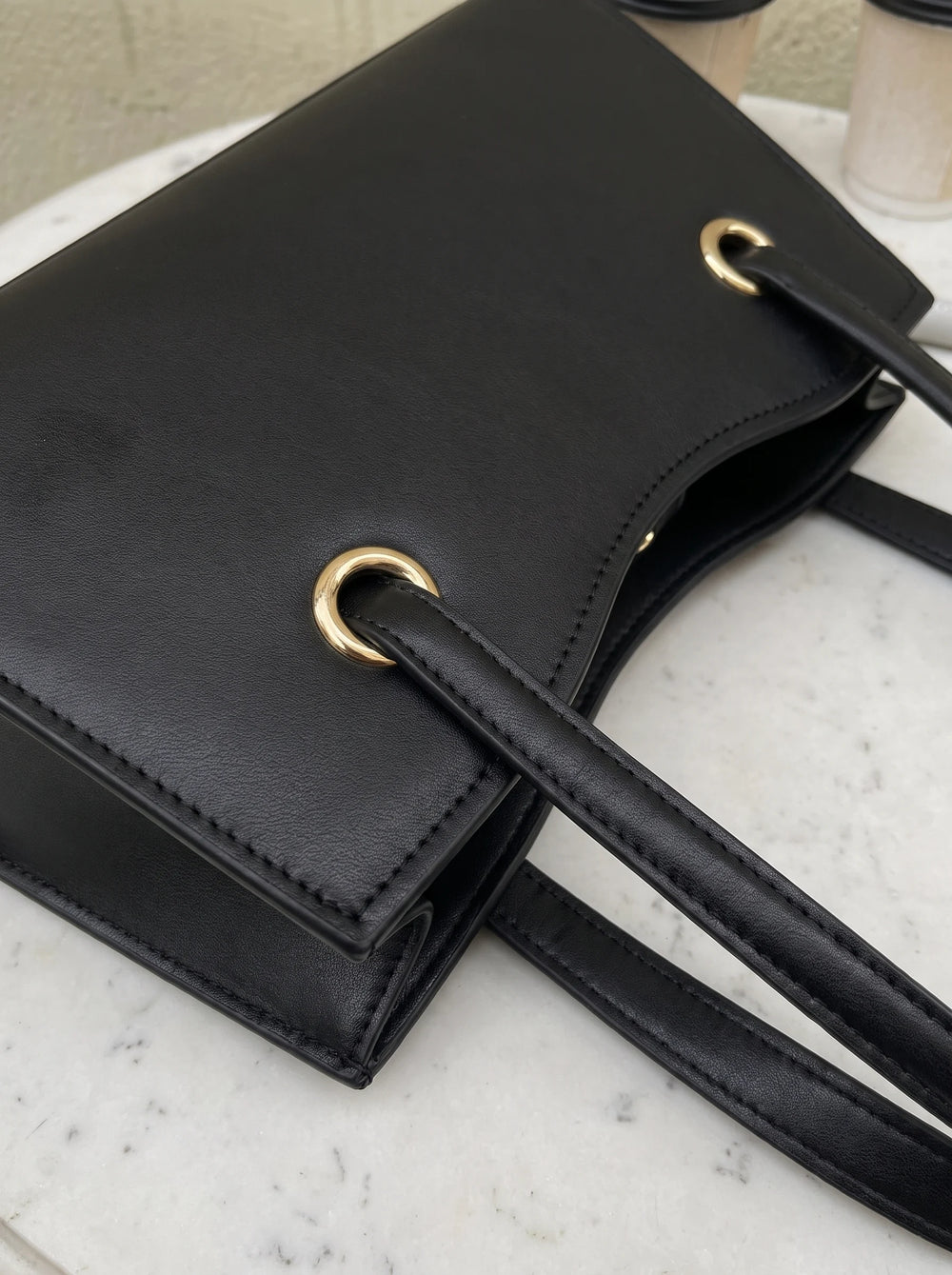 Gold O-ring handle hardware on WestStyle Baul Ring black crossbody bag Instagrammable bag for girls Pakistan