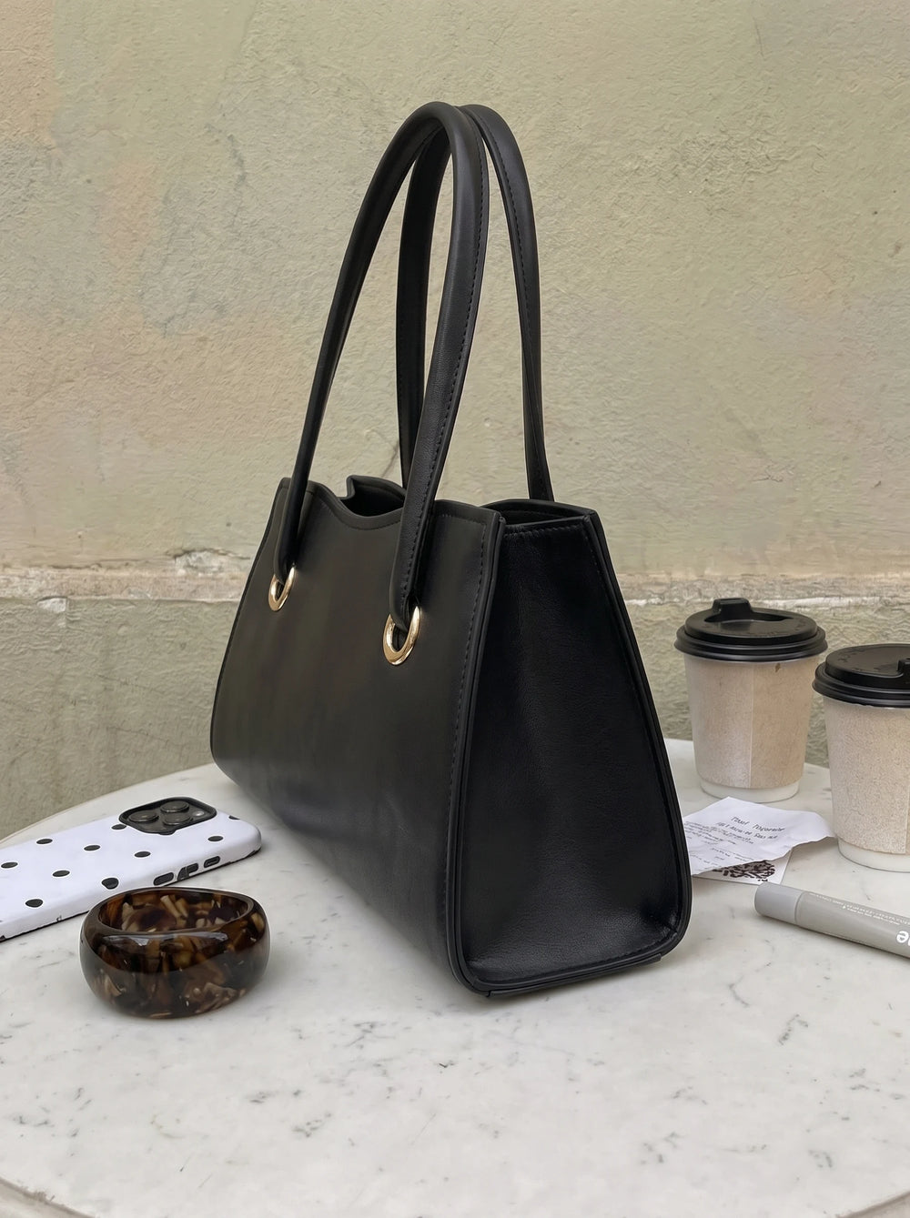 WestStyle Baul Ring black PU leather crossbody bag front view showing gold O-ring hardware viral crossbody bag online Pakistan