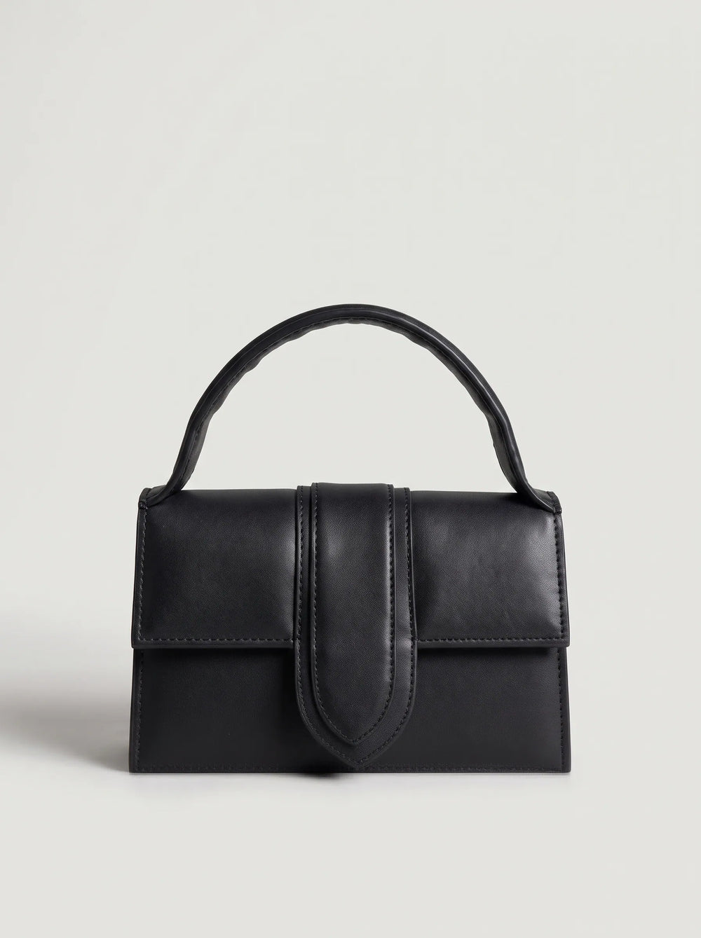 WestStyle black satchel handbag carried by top handle compact structured side bag for women Pakistan