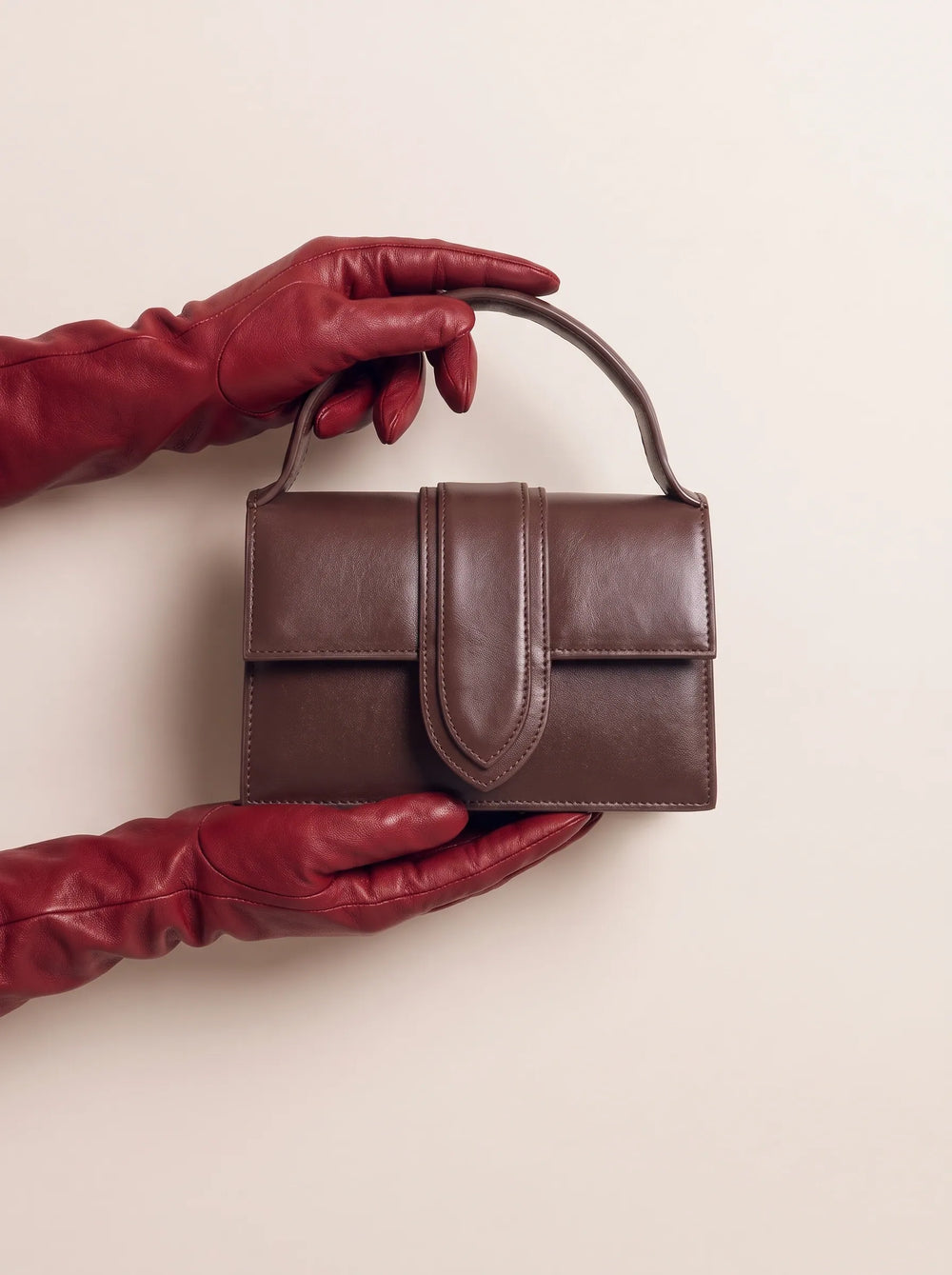 WestStyle brown satchel front view showing semi-gloss finish and centred U-stitched flap cute handbag for girls Pakistan