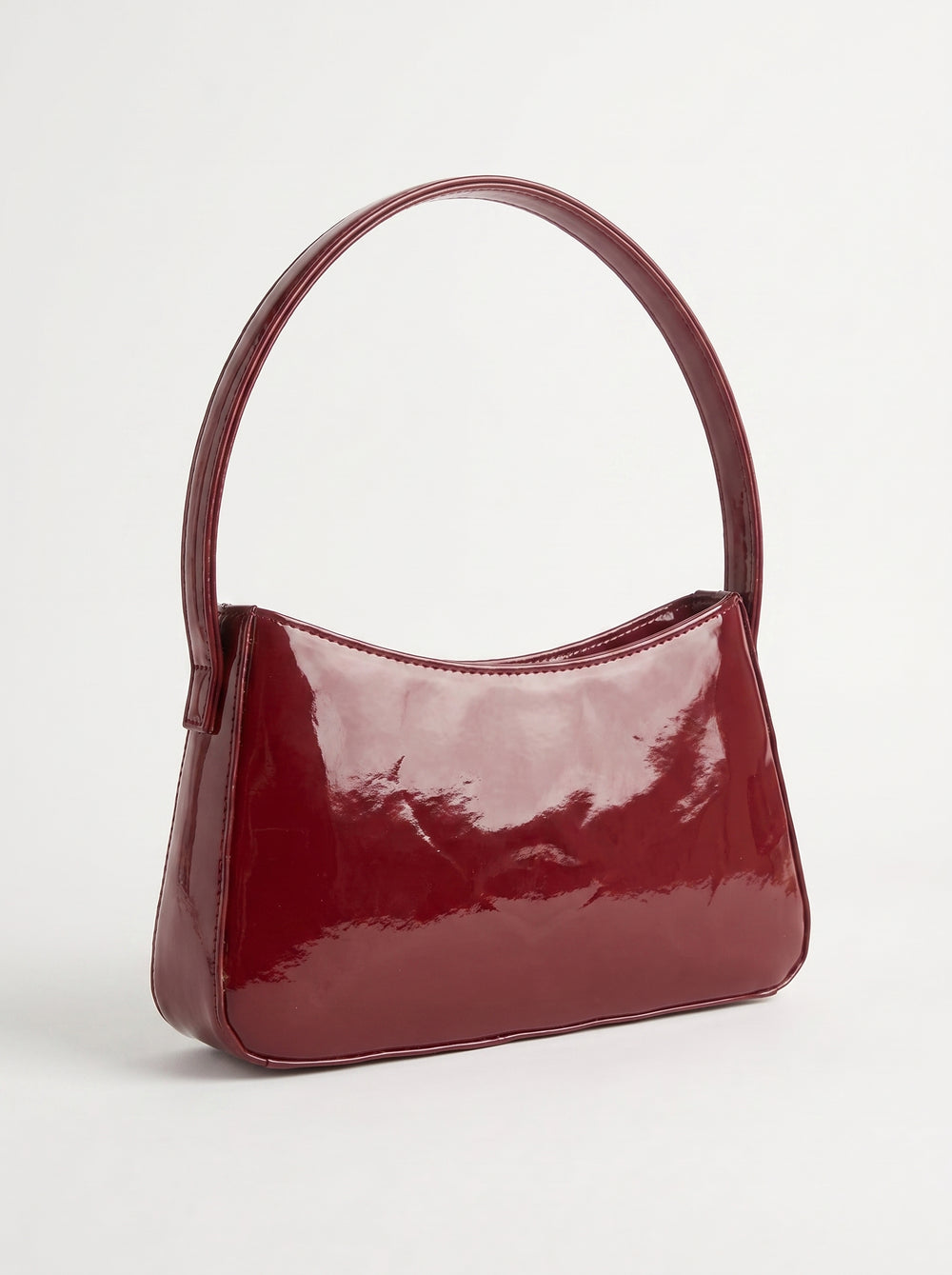 WestStyle Shine Cherry patent shoulder bag side view showing slim baguette silhouette and arched loop handle  fancy handbag Pakistan