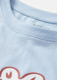 Light blue t-shirt with a red and white graphic design on a plain background
