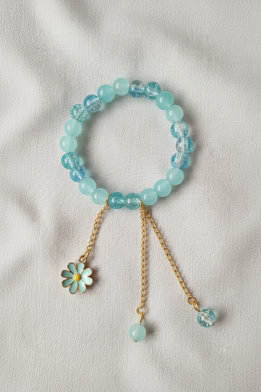 Professional flat lay of aqua bracelet on linen